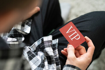 person showing VIP card pass, exclusive access membership