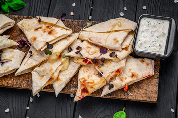 Fried pita bread with cheese and tomatoes