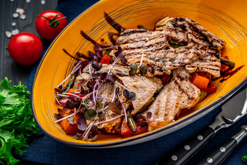 Grilled vegetables and meat with balsamic sauce