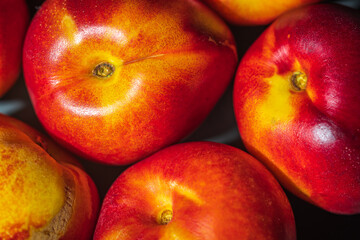 Fototapeta na wymiar Ripe nectarines fruit background closeup