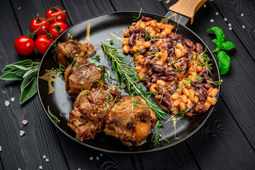 Braised beef tail in a pan with beans