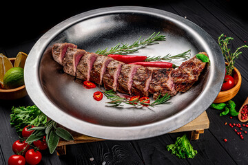Grilled veal tenderloin. Juicy steak medium rare beef with spices