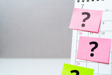 Question mark concept or FAQ. Sign on calendar sticker with copy space