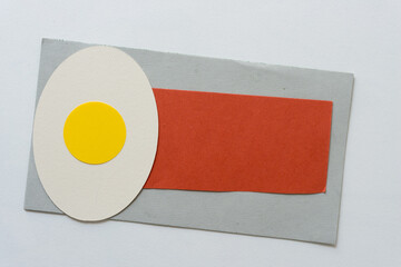 egg on a plate (or oval and circle that resembles an egg and paper that resembles a napkin)
