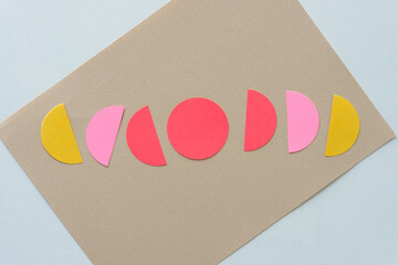 beige and white paper background with circular shapes