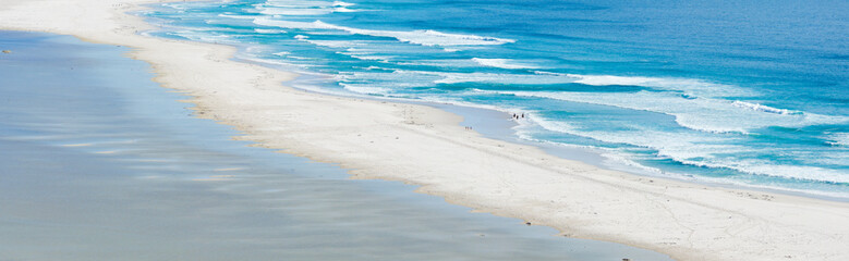 Copy space at the sea with calm ocean waves washing onto a beach shore. Peaceful and idyllic scenic landscape with serene ambience at the coast for a relaxing summer getaway or travel destination