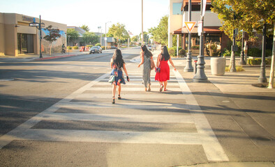Friends walking on the street, Lancaster Blvd, California