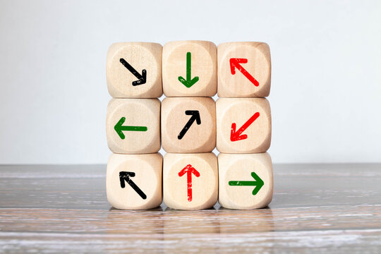 Wooden arrows point to the center on blue background. Space for your text.