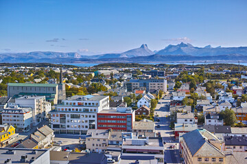 Aerial view of Bodo city in Norway on a sunny day with a blue sky. Scenic modern urban landscape of...