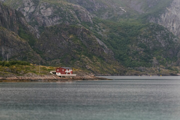 A small lonely house near the mountain and the seashore