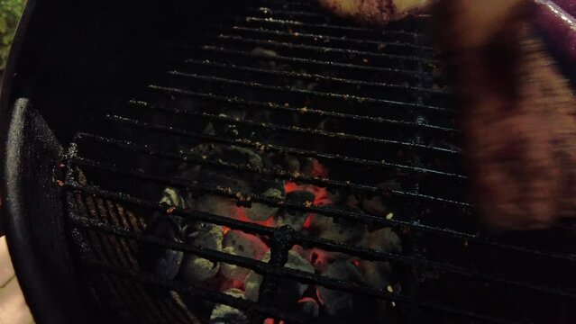 Cooking ribeye steaks on hot BBQ grill