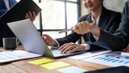 team of financiers are analyzing the company's earnings at meetings, intercompany business meetings.