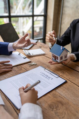 Rental agreement, Sale agent deal to agreement successful home loan contract with customer and sign...