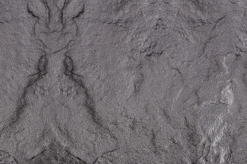 Navy blue background of natural slate. Texture of stone closeup. Graphite backdrop macro