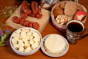 Some mexican food stuff, cheese, sweet mexican bread coffe, chorizo