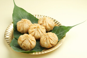 Modak, made from flour and coconut jaggery filling. Modak is a traditional Indian sweet made during Ganesh Utsav and also offered to lord Ganesha.