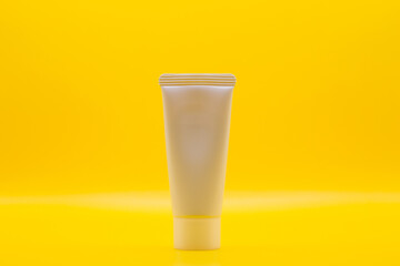 Used cosmetic cream , It is decorated and placed on a yellow screen.