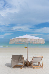 Beach chair set up for traveler to relax on the beach at Koh Semed, Thailand