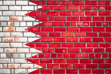 Bahraini flag on a grunge brick background.