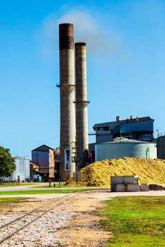 Smoke Coming Out Of Chimney Stacks Of Sugar Mill In North Queensland.