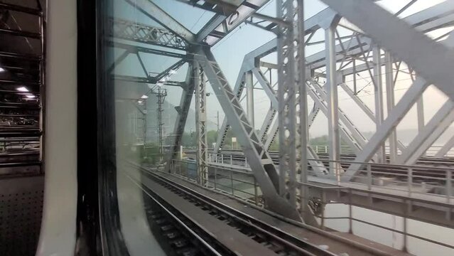 AC train local crossing railway stations at full speed, Central line, Mumbai