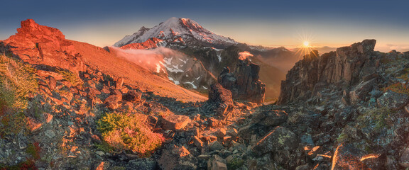 Mount Rainier National Park in the Cascade Range, Washington State, USA. A beautiful active volcano at sunset in North America. Summer time.