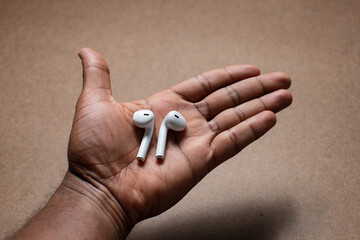 Wireless earbuds are the in palm of hand