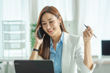 Asian beautiful businesswoman working in the office with a tablet computer for working online video conference concept.