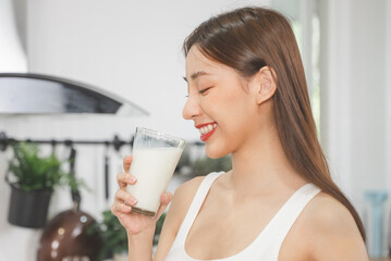 Close up person drinking a glass of milk