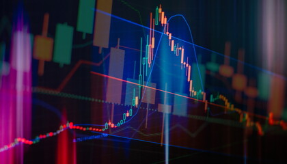 Concept of stock market and fintech. Blurry digital charts over dark blue background.