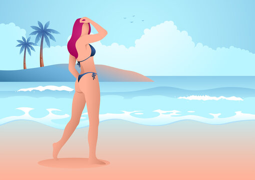 Beautiful woman in blue bikini posing on the beach
