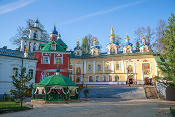 Sunny May day at the temples of the ancient Svyato-Uspensky Pskovo-Pechorsky Monastery, Pechory