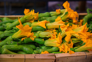 Traditional delicacy from South of France courgette or zucchini flowers at an outdoor farmers...