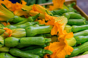 Traditional delicacy from South of France courgette or zucchini flowers at an outdoor farmers market Cours Saleya in the Old Town Nice, French Riviera