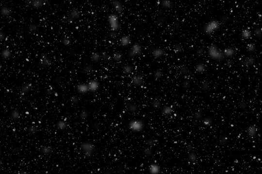 falling snow on black background