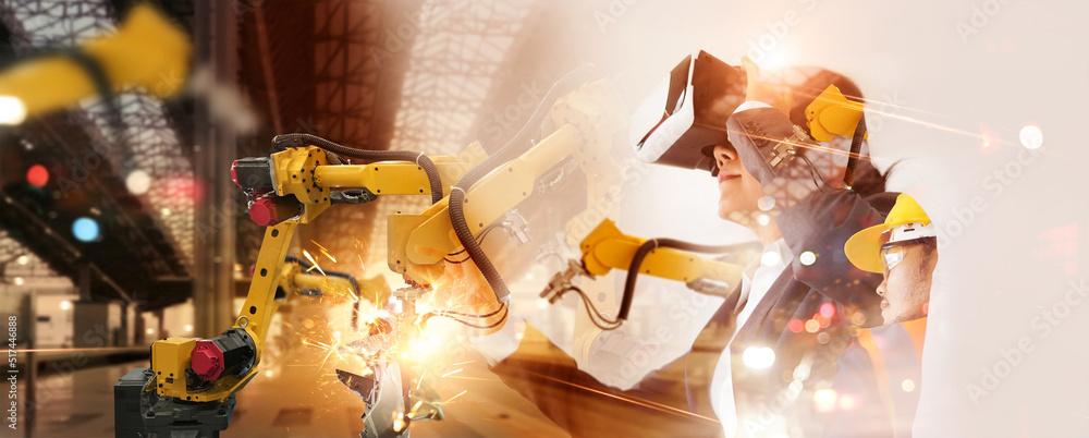Poster Engineer manager wearing virtual reality headset uses VR technology checking and control automation robot arms machine in intelligent factory industrial, Welding robotics and digital manufacturing.