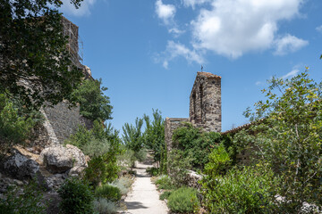 Fototapeta na wymiar Curch and castle ruins in the town of Évenos in Provence, France