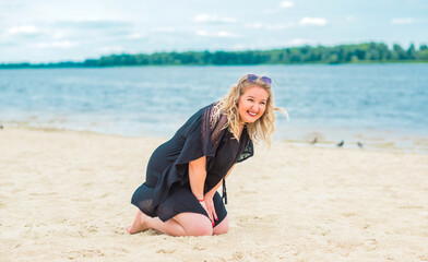 Nice plus size model at beach, European woman in casual dress, big size fashion