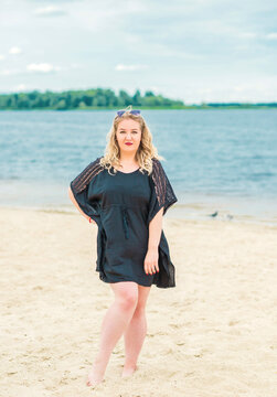 Nice plus size model at beach, European woman in casual dress, big size fashion