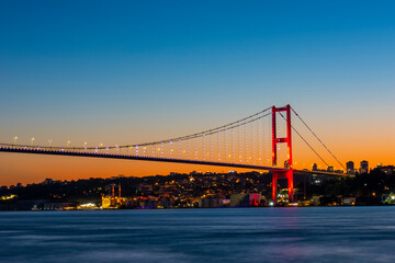 Fototapeta na wymiar Istanbul Bosphorus Bridge with sunset view. 15th July Martyrs Bridge. Istanbul, Turkey.
