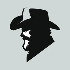 Bearded cowboy portrait side view symbol on gray backdrop. Design element