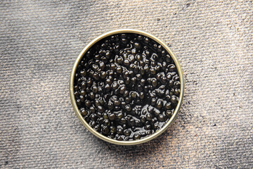 black caviar sturgeon fish beluga, stellate sturgeon fresh healthy meal food snack diet on the table copy space food background rustic top view  - obrazy, fototapety, plakaty