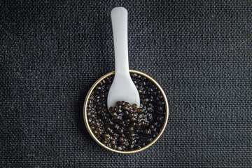 black caviar sturgeon fish beluga, stellate sturgeon fresh healthy meal food snack diet on the table copy space food background rustic top view  - obrazy, fototapety, plakaty