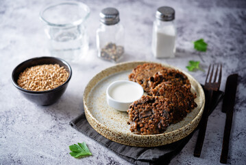 Buckwheat mushroom fritters in a plate with sauce