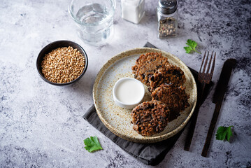 Buckwheat mushroom fritters in a plate with sauce