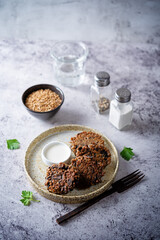 Buckwheat mushroom fritters in a plate with sauce