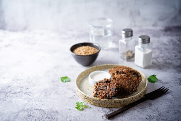 Buckwheat mushroom fritters in a plate with sauce