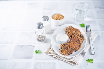 Buckwheat mushroom fritters in a plate with sauce