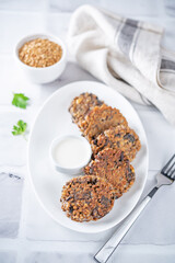 Buckwheat mushroom fritters in a plate with sauce