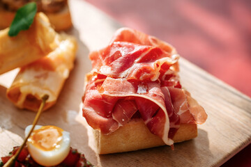 Closeup on gourmet bruschetta with italian prosciutto ham